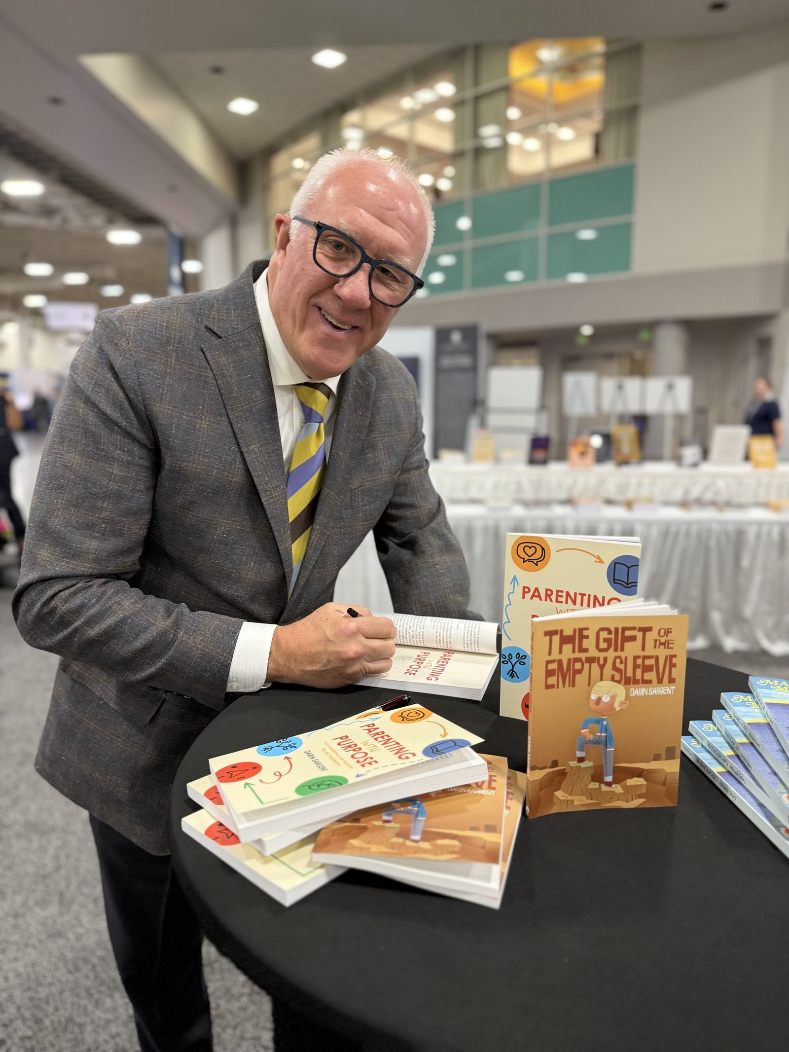 Darin Sargent signing copies of The Gift of the Empty Sleeve